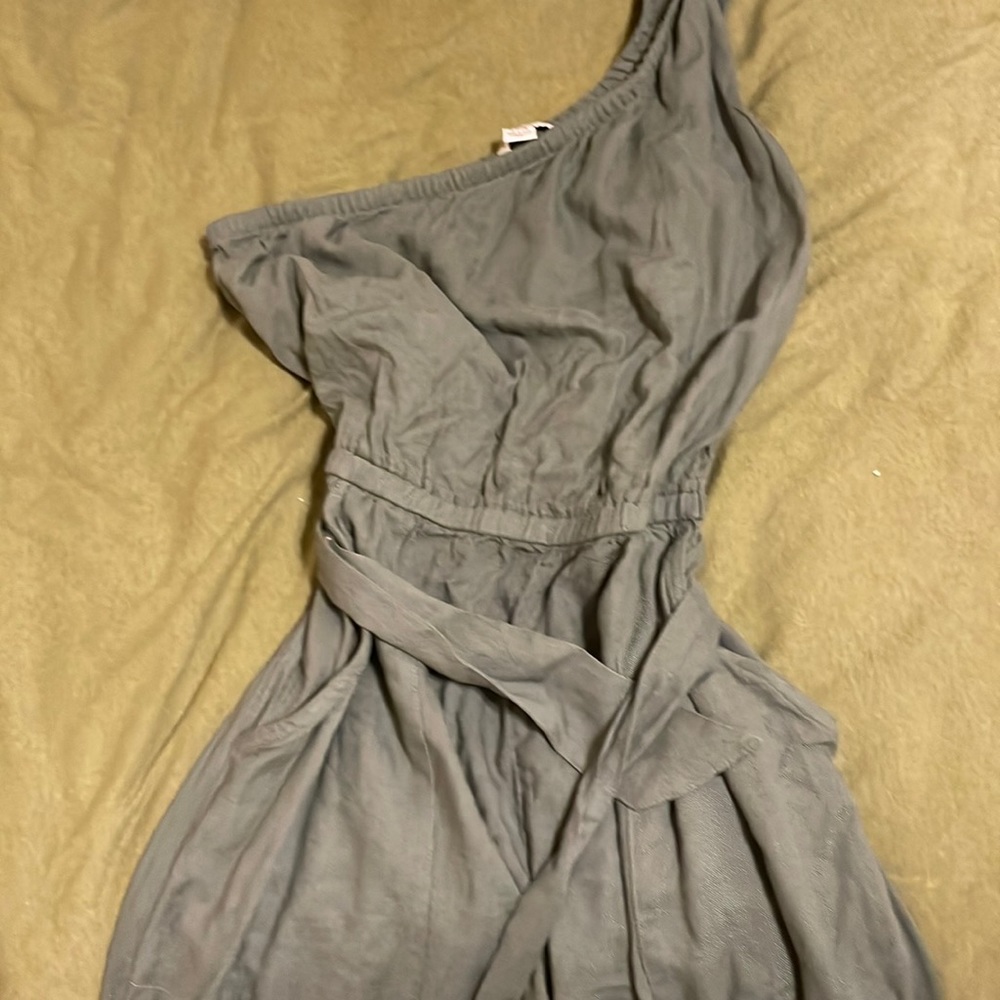 One shoulder jumpsuit. Waist tie. Pockets. Scrunched waist and ankles.